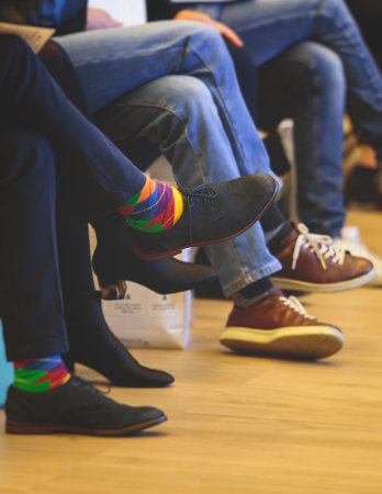Speakers shoes at the business conference event, audience at the lecture hall listens to lecturer, persons on a stage at master-class, corporate business congress seminar at the venueの写真素材