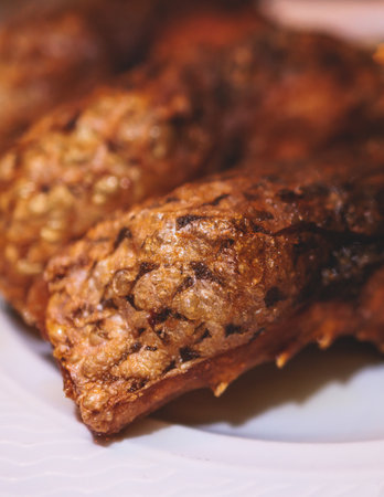 Fried grilled carp, roasted carp fish on plate with lemon and salad served in a traditional...