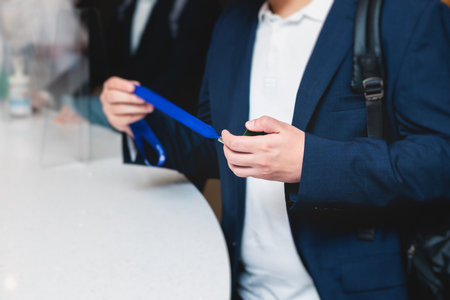 Process of checking in on a conference congress forum event, registration desk table, visitors and...