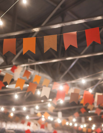 Crowded Christmas market with New Year decorations and multicolored flags, balloons, garlands and...