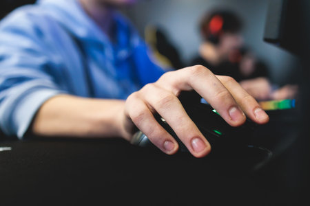 Cyber sport e-sports tournament, team of professional gamers, hands on a mouse and keyboard, players...