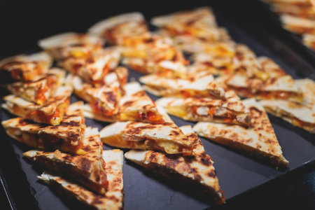 Catering table, beautifully decorated banquet with variety of with different food snacks appetizers on corporate birthday party event or wedding celebration, canape, salad, delicatessen settingの写真素材