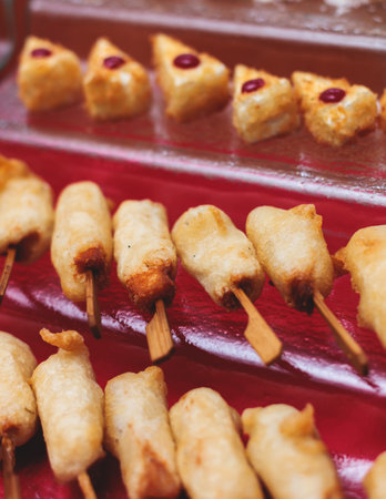 Catering table, beautifully decorated banquet with variety of with different food snacks appetizers on corporate birthday party event or wedding celebration, canape, salad, delicatessen settingの写真素材