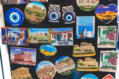 Traditional tourist souvenirs and gifts from Greece, refrigerator magnets with text "Greece", and key ring keychain, mugs and toys in a local vendor shop in Athens, Attica, Greece, greek souvenirsの写真素材