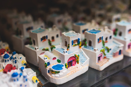 Traditional tourist souvenirs and gifts from Greece, refrigerator magnets with text Greece, and key...