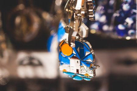 Traditional tourist souvenirs and gifts from Greece, refrigerator magnets with text "Greece", and key ring keychain, mugs and toys in a local vendor shop in Athens, Attica, Greece, greek souvenirsの写真素材