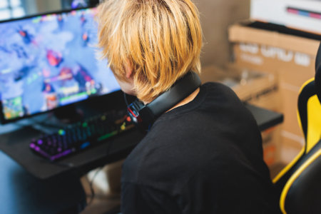 Cyber sport e-sports tournament, team of professional players, gamers playing online esports championship in competitive moba, strategy fps game in a cyber games arena club, person in a chair with pcの写真素材