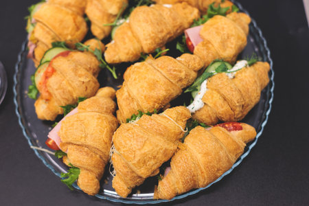 Catering table, beautifully decorated banquet table with variety of different food snacks,...