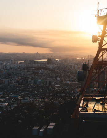 Beautiful vibrant aerial sunset view of Seoul, South Korea skyline, with mountains and sprin scenery...