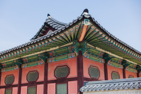 Gyeongbokgung Palace, Seoul, Jongno District, South Korea, in a spring sunny day, exterior view of main Korean royal palace in Cherry Blossom season, with Bugaksan mountain in the backgroundの写真素材