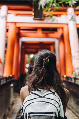 Fushimi Inari Taisha Shrine, Fushimi-ku, Kyoto Prefecture, Kansai region, Kyoto, Japan, Shinto shrine, mountain way with red torii gates tunnel, wooden torii path, fox sculptures, travel to Japanの写真素材