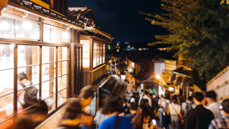 View of Gion district street, Kyoto, Higashiyama-ku, Japan, night illumination of Ninnenzaka and Sannenzaka streets, with old wooden tea houses Hokanji temple and Yasaka Pagoda, Gion geisha quarterの写真素材