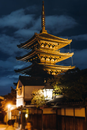 View of Gion district street, Kyoto, Higashiyama-ku, Japan, night illumination of Ninnenzaka and Sannenzaka streets, with old wooden tea houses Hokanji temple and Yasaka Pagoda, Gion geisha quarterの写真素材