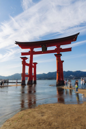 Itsukushima Shrine landscape view, Grand Torii floating gate, Japan, Hiroshima prefecture, Miyajima island panorama, Japan in a summer sunny day (Text on the gate - Itsukushima Shrine), Shinto shrineの写真素材