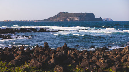 Jeju-do, Seongsan Ilchulbong landscape, volcanic tuff cone, Sunrise peak, Jeju Island, South Korea, Seongsan-ri, Seogwipo, Jeju Province landscape view in a sunny day, with sea, cliffs hiking trailの写真素材