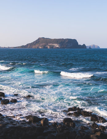 Jeju-do, Seongsan Ilchulbong landscape, volcanic tuff cone, Sunrise peak, Jeju Island, South Korea, Seongsan-ri, Seogwipo, Jeju Province landscape view in a sunny day, with sea, cliffs hiking trailの写真素材