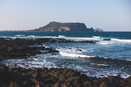 Jeju-do, Seongsan Ilchulbong landscape, volcanic tuff cone, Sunrise peak, Jeju Island, South Korea, Seongsan-ri, Seogwipo, Jeju Province landscape view in a sunny day, with sea, cliffs hiking trailの写真素材