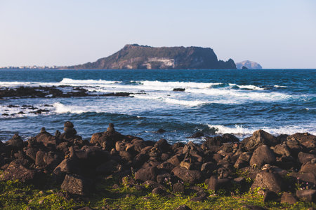 Jeju-do, Seongsan Ilchulbong landscape, volcanic tuff cone, Sunrise peak, Jeju Island, South Korea, Seongsan-ri, Seogwipo, Jeju Province landscape view in a sunny day, with sea, cliffs hiking trailの写真素材