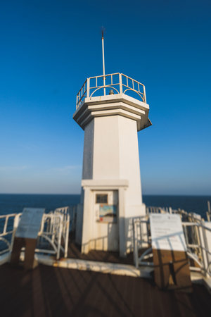 Jeju-do, Seopjikoji cape landscape with lighthouse and sea, east coast of Jeju Island, South Korea, Seongsan-ri, Seogwipo, Jeju Province view in a sunny day, with sea and cliffsの写真素材