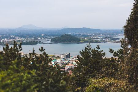 Jeju-do, Seongsan Ilchulbong landscape, volcanic tuff cone, Sunrise peak, Jeju Island, South Korea, Seongsan-ri, Seogwipo, Jeju Province landscape view in a sunny day, with sea, cliffs hiking trailの写真素材