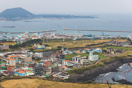 Jeju-do, Seongsan Ilchulbong landscape, volcanic tuff cone, Sunrise peak, Jeju Island, South Korea, Seongsan-ri, Seogwipo, Jeju Province landscape view in a sunny day, with sea, cliffs hiking trailの写真素材