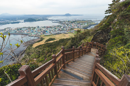 Jeju-do, Seongsan Ilchulbong landscape, volcanic tuff cone, Sunrise peak, Jeju Island, South Korea, Seongsan-ri, Seogwipo, Jeju Province landscape view in a sunny day, with sea, cliffs hiking trailの写真素材