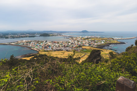 Jeju-do, Seongsan Ilchulbong landscape, volcanic tuff cone, Sunrise peak, Jeju Island, South Korea, Seongsan-ri, Seogwipo, Jeju Province landscape view in a sunny day, with sea, cliffs hiking trailの写真素材