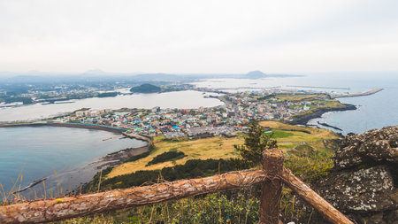 Jeju-do, Seongsan Ilchulbong landscape, volcanic tuff cone, Sunrise peak, Jeju Island, South Korea, Seongsan-ri, Seogwipo, Jeju Province landscape view in a sunny day, with sea, cliffs hiking trailの写真素材
