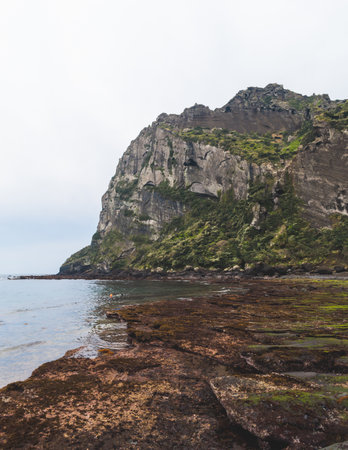 Jeju-do, Seongsan Ilchulbong landscape, volcanic tuff cone, Sunrise peak, Jeju Island, South Korea, Seongsan-ri, Seogwipo, Jeju Province landscape view in a sunny day, with sea, cliffs hiking trailの写真素材