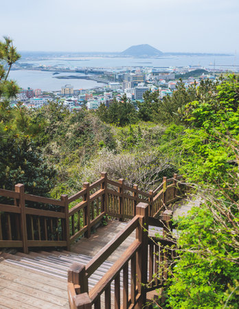 Jeju-do, Seongsan Ilchulbong landscape, volcanic tuff cone, Sunrise peak, Jeju Island, South Korea, Seongsan-ri, Seogwipo, Jeju Province landscape view in a sunny day, with sea, cliffs hiking trailの写真素材