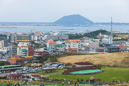 Jeju-do, Seongsan Ilchulbong landscape, volcanic tuff cone, Sunrise peak, Jeju Island, South Korea, Seongsan-ri, Seogwipo, Jeju Province landscape view in a sunny day, with sea, cliffs hiking trailの写真素材