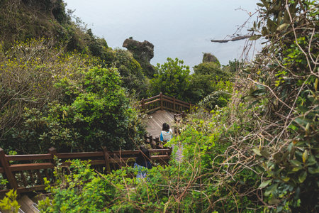 Jeju-do, Seongsan Ilchulbong landscape, volcanic tuff cone, Sunrise peak, Jeju Island, South Korea, Seongsan-ri, Seogwipo, Jeju Province landscape view in a sunny day, with sea, cliffs hiking trailの写真素材