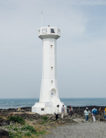 Lighthouse on Udo Island, Jeju Island province, South Korea, coastline sea landscape sunny view with Lightの写真素材