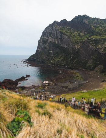 Jeju-do, Seongsan Ilchulbong landscape, volcanic tuff cone, Sunrise peak, Jeju Island, South Korea, Seongsan-ri, Seogwipo, Jeju Province landscape view in a sunny day, with sea, cliffs hiking trailの写真素材