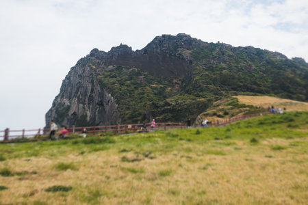 Jeju-do, Seongsan Ilchulbong landscape, volcanic tuff cone, Sunrise peak, Jeju Island, South Korea, Seongsan-ri, Seogwipo, Jeju Province landscape view in a sunny day, with sea, cliffs hiking trailの写真素材