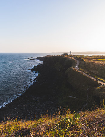 Jeju-do, Seopjikoji cape landscape with lighthouse and sea, east coast of Jeju Island, South Korea,...