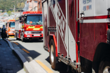 South Korean Fire fighting brigade equipment, during operation in the streets, firefighters with...