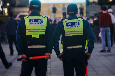 Korean police squad formation in uniform with Police logo, policemen officer patrol maintain public...