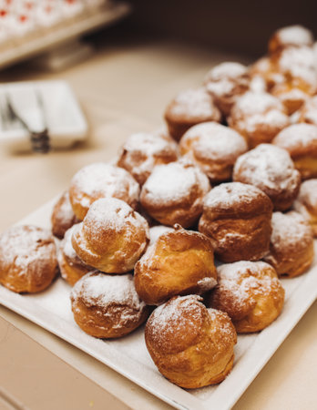 Set of coffee break in the hotel during conference meeting, with tea and coffee catering, decorated catering banquet table with variety of different pastry and bakery, with croissants, pie and cookiesの写真素材