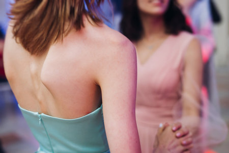 High school graduates dancing on prom, waltz and classical ball slow dance in dresses and suits on school graduation party, boys and girls ballroom dancers, couples dance quadrille, polonaiseの写真素材
