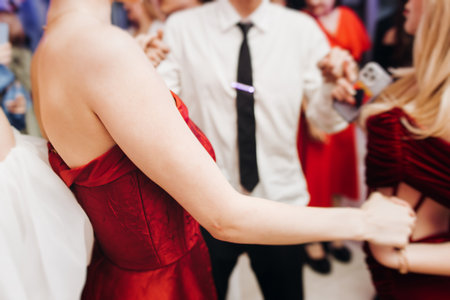 High school graduates dancing on prom, waltz and classical ball slow dance in dresses and suits on school graduation party, boys and girls ballroom dancers, couples dance quadrille, polonaiseの写真素材