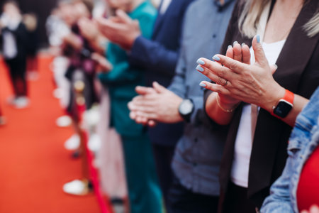 Red carpet with ropes and golden barriers on a luxury party entrance, cinema premiere film festival event award gala ceremony, wealthy rich guests arriving, outdoor decoration elements, summer dayの写真素材