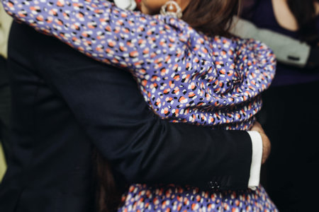Couples dancing traditional latin argentinian dance milonga in a ballroom, tango salsa bachata lesson in red and purple lights, performance rehearsal, evening dance school class festivalの写真素材