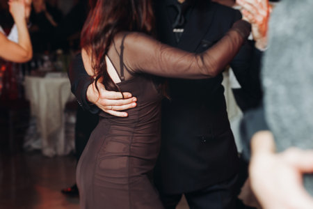 Couples dancing traditional latin argentinian dance milonga in a ballroom, tango salsa bachata...