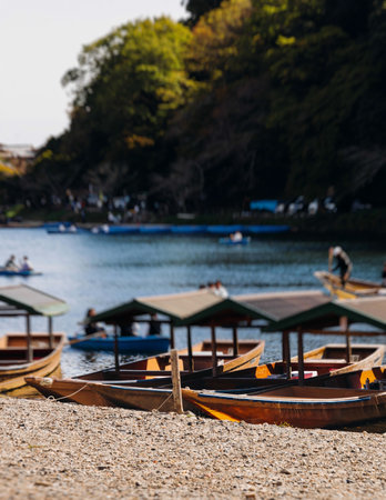 Arashiyama district panorama in western Kyoto, Japan, with boats and mountain Arashi, Togetsukyo bridge, Katsura Hozu River, autumn fall landscape view, travel to Japan, Kansai region, Kyotoの写真素材