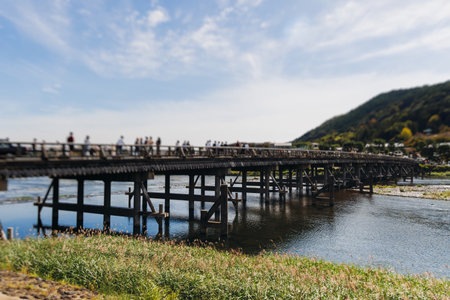 Arashiyama district panorama in western Kyoto, Japan, with boats and mountain Arashi, Togetsukyo...