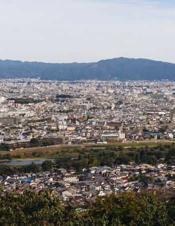Kyoto panorama, Japan, beautiful super wide aerial view, with city skyline and mountains, seen from the observation deck in autumn fall sunny day with a blue sky, Kyoto prefecture, Kansai regionの写真素材