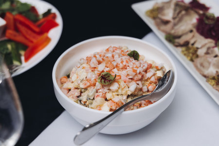 Catering table, beautifully decorated banquet with variety of different food snacks appetizers on Christmas birthday corporate party event or wedding celebration, canape, salad, delicatessen settingの写真素材