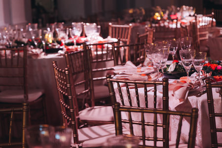 Beautiful table decoration for luxury event in pink and gold, cutlery and tableware, banquet hall...