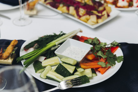 Catering table, beautifully decorated banquet with variety of different food snacks appetizers on Christmas birthday corporate party event or wedding celebration, canape, salad, delicatessen settingの写真素材